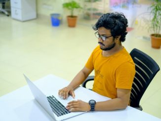 Agile Scrum software developer looking at computer screen