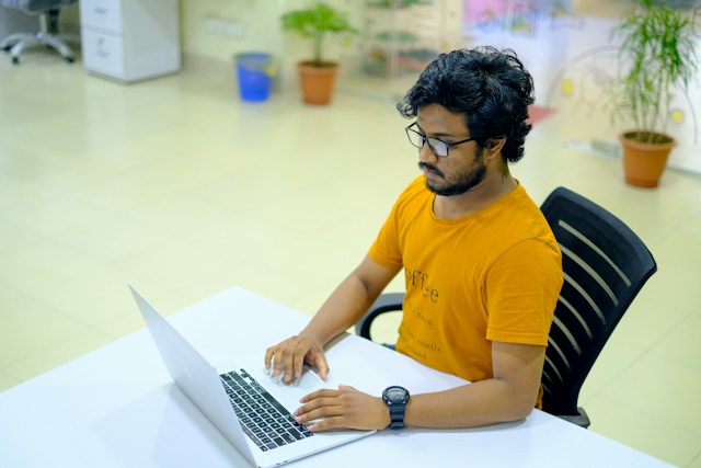 Agile Scrum software developer looking at computer screen
