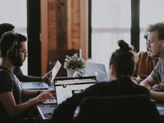 Group of 5 people working with computers